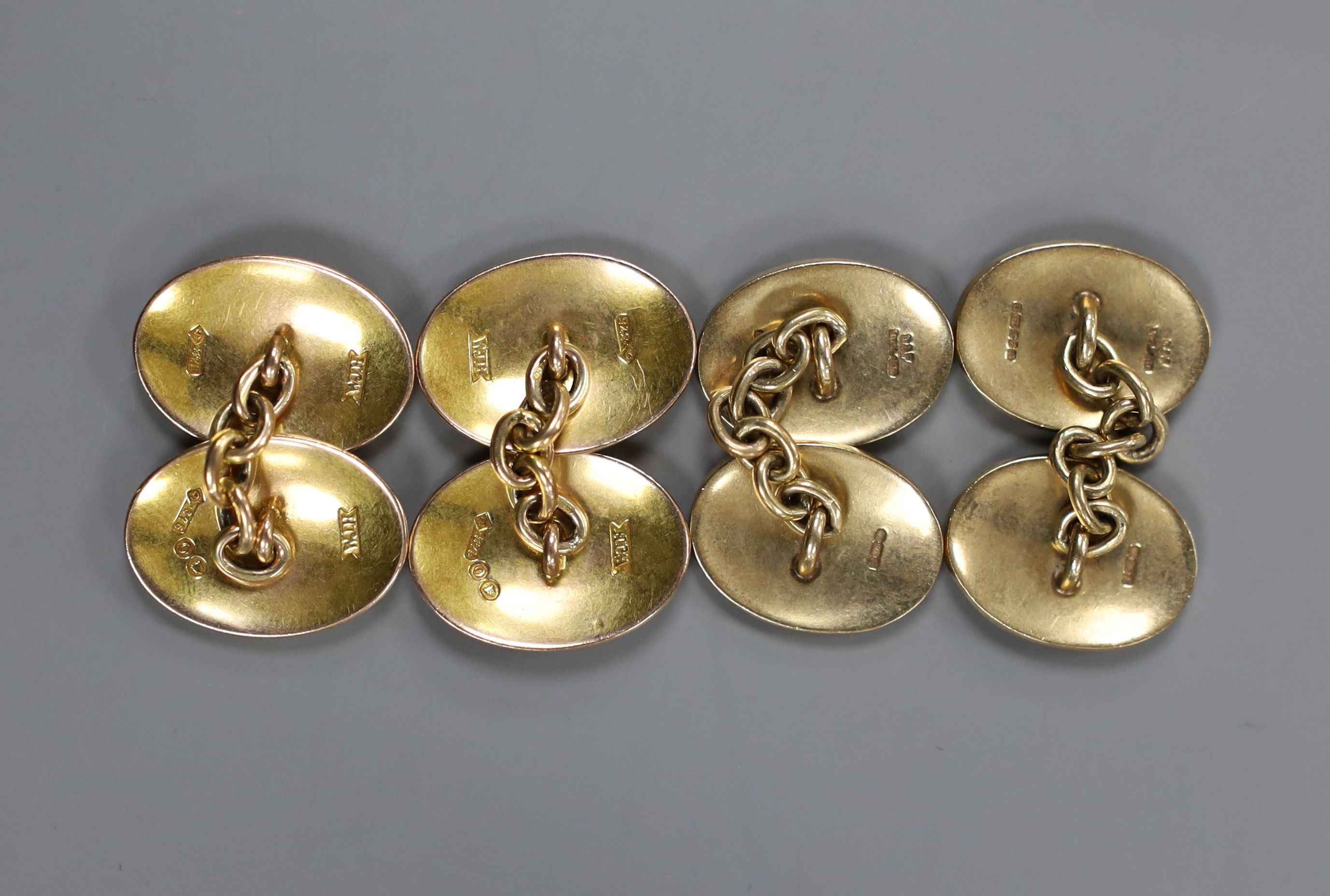 Two pairs of 9ct gold oval cufflinks including engraved, 26.7 grams.